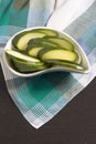 Zucchini sliced Ã¢â¬â¹Ã¢â¬â¹on green Scottish plaid tablecloth.